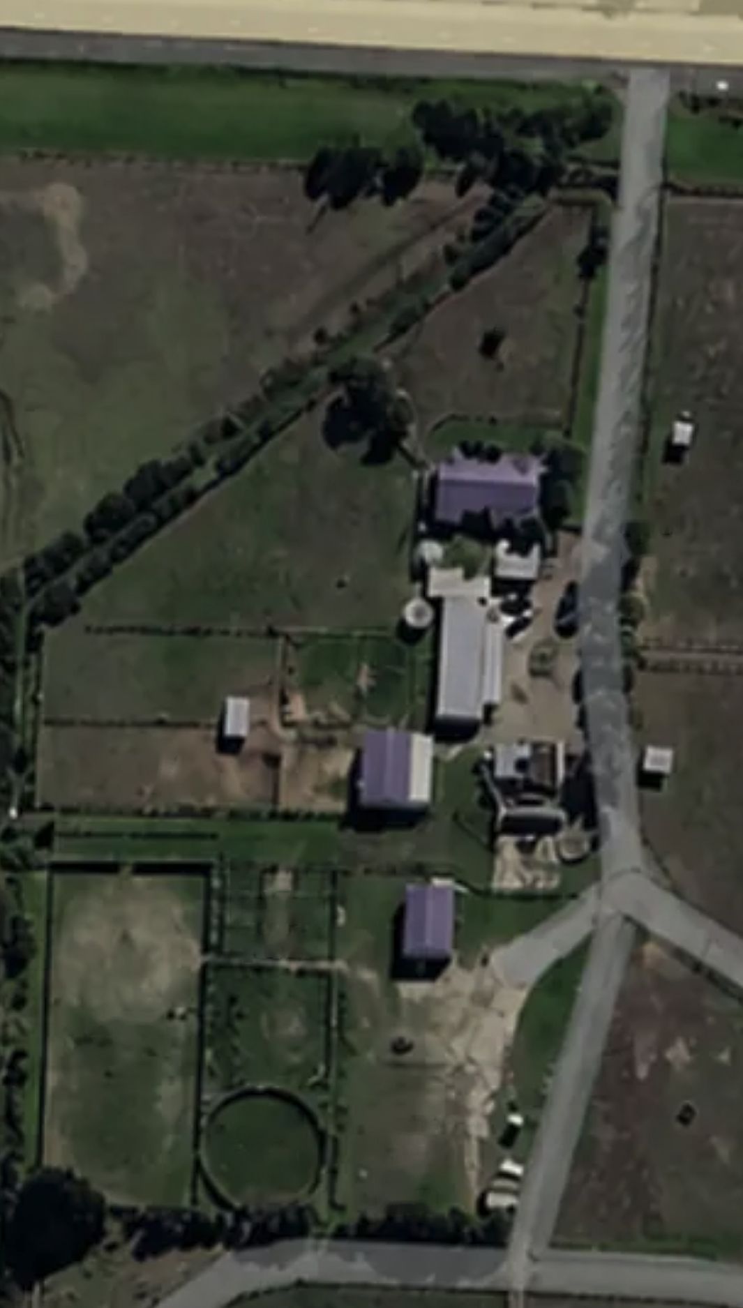 Close-up aerial view of the homestead precinct showing small paddocks A to D, the wash bay, holding yards, arena, round yard and float parking bays